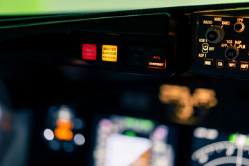 close-up of the cockpit of a passenger plane with many buttons on the control panel of an airplane...