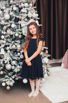 girl in home christmas room