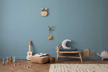 Stylish kid room with copy space, rattan bench, pouf, toys, teddy, decoration and personal...