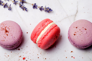 Colored macaroons. Delicious sweet colorful French desserts on light background. Menu concept