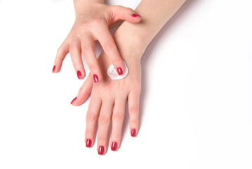 Woman put the creame on her hand.