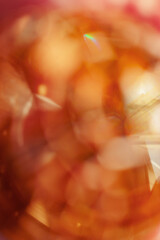 Defocused abstract bokeh background yellow golden color, flare from lights, monochrome photo,...