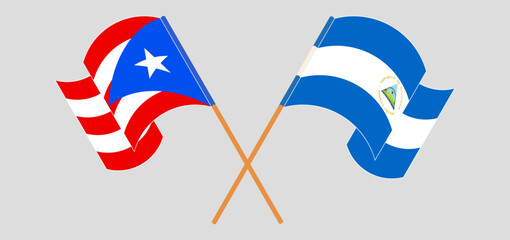 Crossed and waving flags of Puerto Rico and Nicaragua