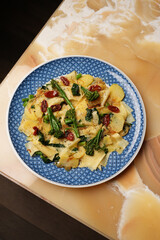 Vegetarian pasta with broccoli potato and tomatoes