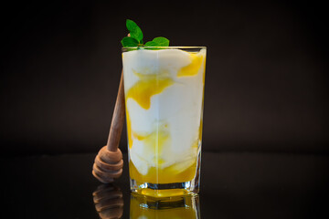 prepared homemade yogurt with natural honey in a glass