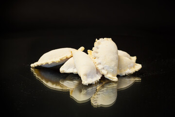 Fototapeta na wymiar Raw dumplings with filling inside, Ukrainian cuisine.