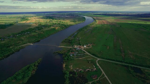 Infrastructure of the region. Aerial footage of ponton bridge over river at sunny day.