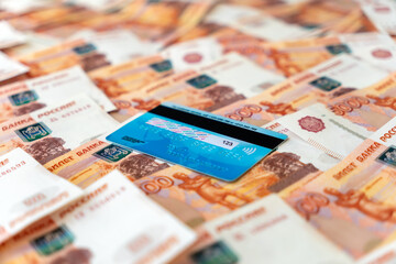 money from Russian rubles and plastic Bank card. financial payment system in Russia. - obrazy, fototapety, plakaty