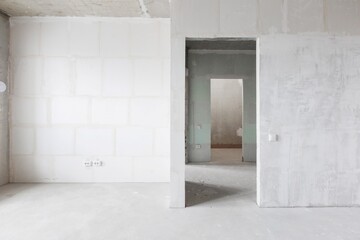 interior of the apartment without decoration in gray colors. rough finish