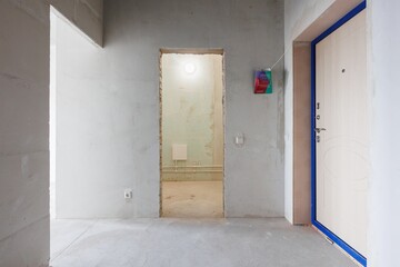 interior of the apartment without decoration in gray colors. rough finish