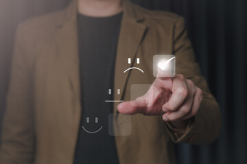 Customer service satisfaction rating concept, Businessman in suit touching virtual screen To rate...