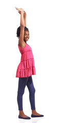 Portrait, fashion and children with a black girl hands raised in studio isolated on a white background. Smile, winner or celebration and a happy young model kids with a victory gesture for success