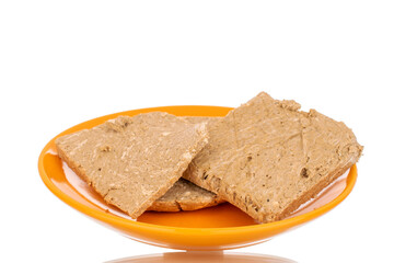 Three pieces of sweet halva on a ceramic saucer, macro, isolated on white background.