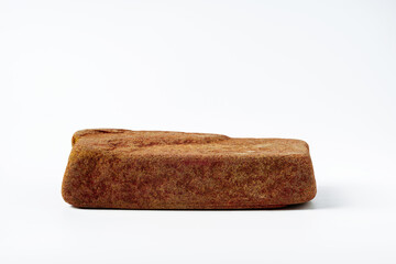 Piece of granite stone isolated on white background