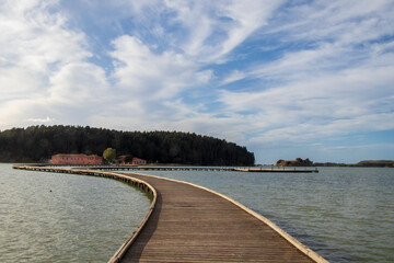 wooden bridge across the sea leading to the old church in Albania, albania in november 2023, albania landscape