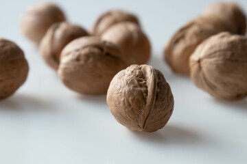 Walnuts on a white background. Close-up, selective focus.