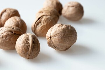 Walnuts on a white background. Close-up, selective focus.