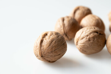 Walnuts on a white background. Close-up, selective focus.