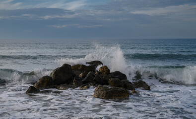 waves crashing on rocks on the Mediterranean coast 11