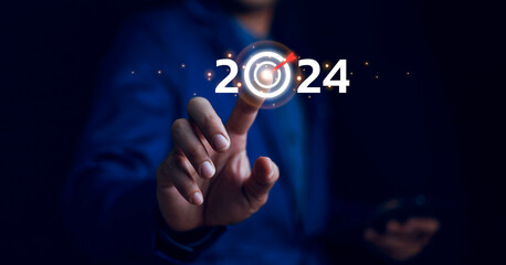 Business plan 2024 concept, business goals trends 2024, Analytical businessperson planning strategy...