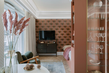 Stylish interior of micro apartment with design furniture. Home decor. Template.