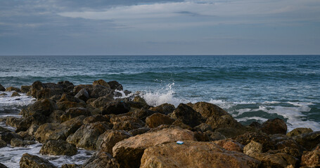 Fototapeta na wymiar waves crashing on rocks on the Mediterranean coast 8