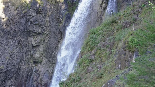 Waterfall Reichenbach falls flowing in Rosenlaui Gletscherschlucht at Berner Oberland, Switzerland