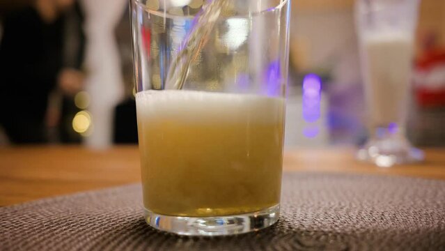 Man pouring fresh beer into the glass mug. 4k video footage UHD 3840x2160