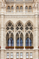 Fototapeta na wymiar Rathaus city hall decorated gothic facade. Vertical. Vienna, Austria