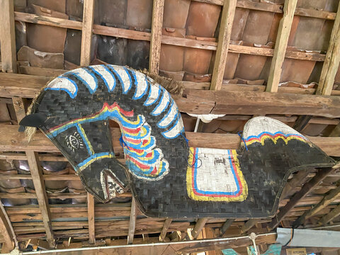 Kuda Lumping or Flat Horse made from woven bamboo hanging on traditional javanese joglo house ceilings. Traditional dance from Ponorogo, Java, Indonesia.