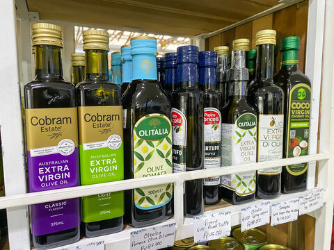 Yogyakarta, Indonesia - December 7, 2023: Various packaged Extra Virgin Olive Oil made from seeds, nut and beans which contain nutrients for health. Vegan or vegetarian and plant based diet Concept.