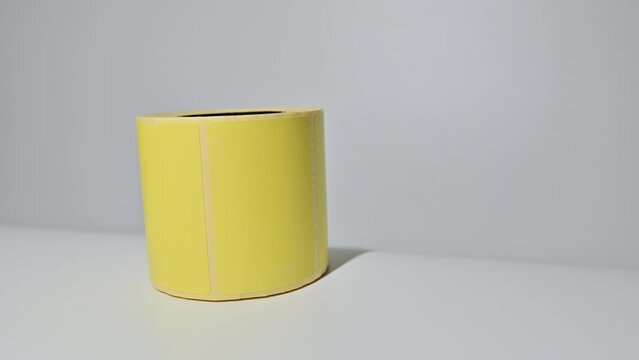 Yellow thermal barcode roll.	Barcode label roll for direct thermal or thermal transfer printing. Blank price label roll.
