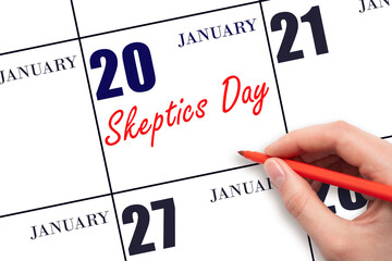 January 20. Hand writing text Skeptics Day on calendar date. Save the date.