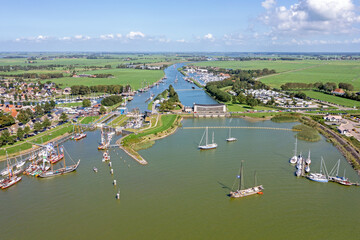 Aerial view from the sluice at Stavoren on a busy summer day in the Netherlands - obrazy, fototapety, plakaty