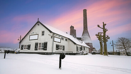 Traditional limekilns factory in Huizen the Netherlands in winter at sunset