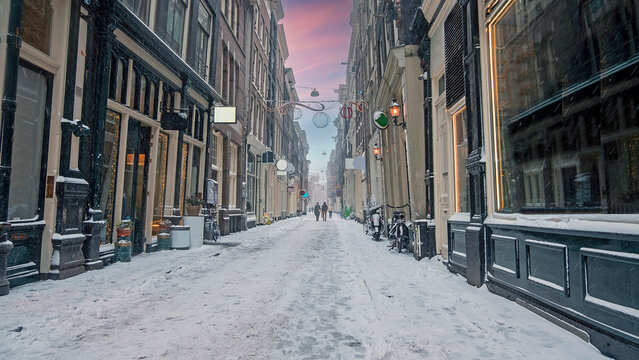 Snowy red light district in Amsterdam the Netherlands at sunset