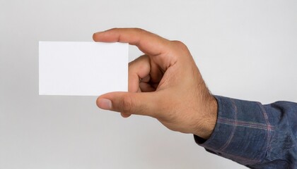 Obraz premium Man hand holding a blank card isolated on a white background