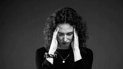 Dramatic Woman with Anxious Expression in black and white monochrome. Burnout emotion of 20s person...