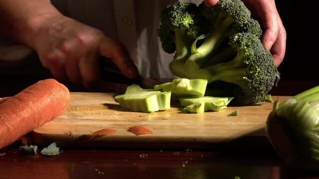 Woman chopping celery vegetables for soup maker 