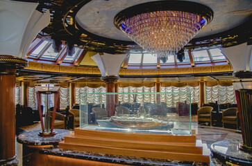 Opulent elegant interiors inside ballroom lounge onboard ocean liner cruiseship cruise ship witch...