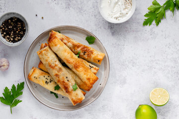 Turkish Cigara Börek (Sigara böreği) or Cigarette Pastry with Spinach and Feta Cheese with...