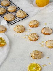 Homemade Italian lemon shortbread cookies with glaze and almond. Shortbread citrus biscuits on white stone background