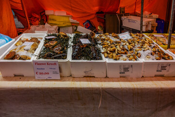 Many kinds of seafood on sell in Albert Cuyp Market in Amsterdam. Albert Cuypmarkt is the largest and most popular outdoor market in the Netherlands. Amsterdam, Netherlands.