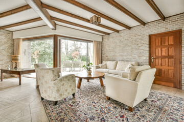 Cozy living room with furniture and brick wall