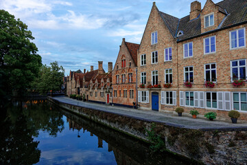 Bruges Belgium 03 08 2023: Medieval Town old city in Flanders Europe. Art and culture. Tourists from the world. Ancient medieval architecture gothic with towers buildings, canals, cobbled alleyways