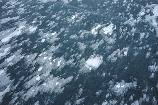 Textured Ice Surface with Subtle Snowflakes