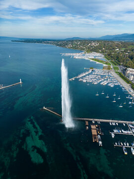 Aerial view of a jet fountain in a marina on a sunny day