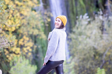 Young girl smiling outdoors in autumn - 692113172