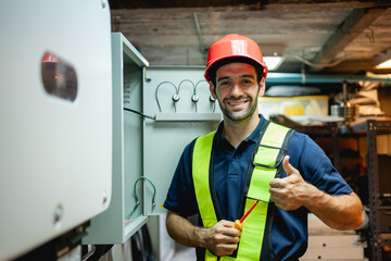 Technician Engineering setting inverter solar panel in electrical room. Service engineer installing...