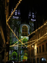Quimper, Bretagne, France; December 8 2023: Light show at Saint Corentin Cathedral for Noël. Christmas ambiance and decoration.